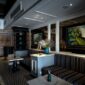 Keanggunan interior lobi hotel bersejarah yang memadukan detail arsitektur klasik zaman dulu dengan pencahayaan hangat, menciptakan atmosfer nostalgia yang mewah bagi para tamu.